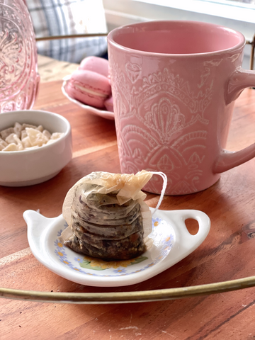 MediTea Wellness - Compostable tea bag in coaster and pink ceramic mug