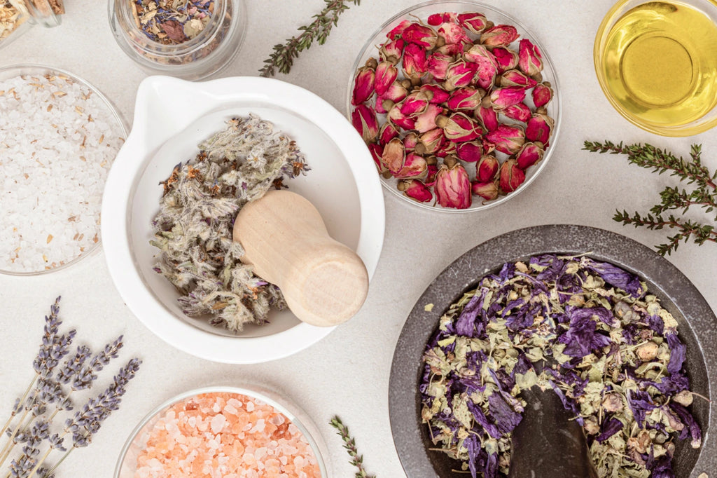 herbs in bowls with pestle and mortar