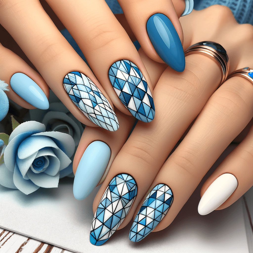 Alt text: A set of long, almond-shaped nails featuring a mix of solid light blue, white, and intricate blue and white geometric patterns, resting on a folded fabric with a blue flower in the background.