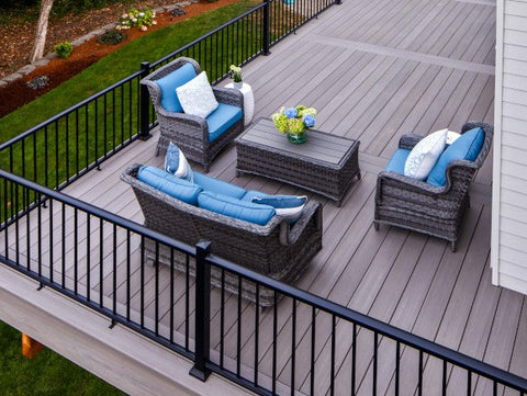 Fiberon CountrySide railing on a second-story deck with outdoor furniture