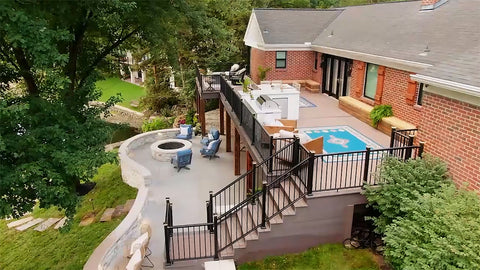 A fully renovated outdoor living space featuring a second-story deck.