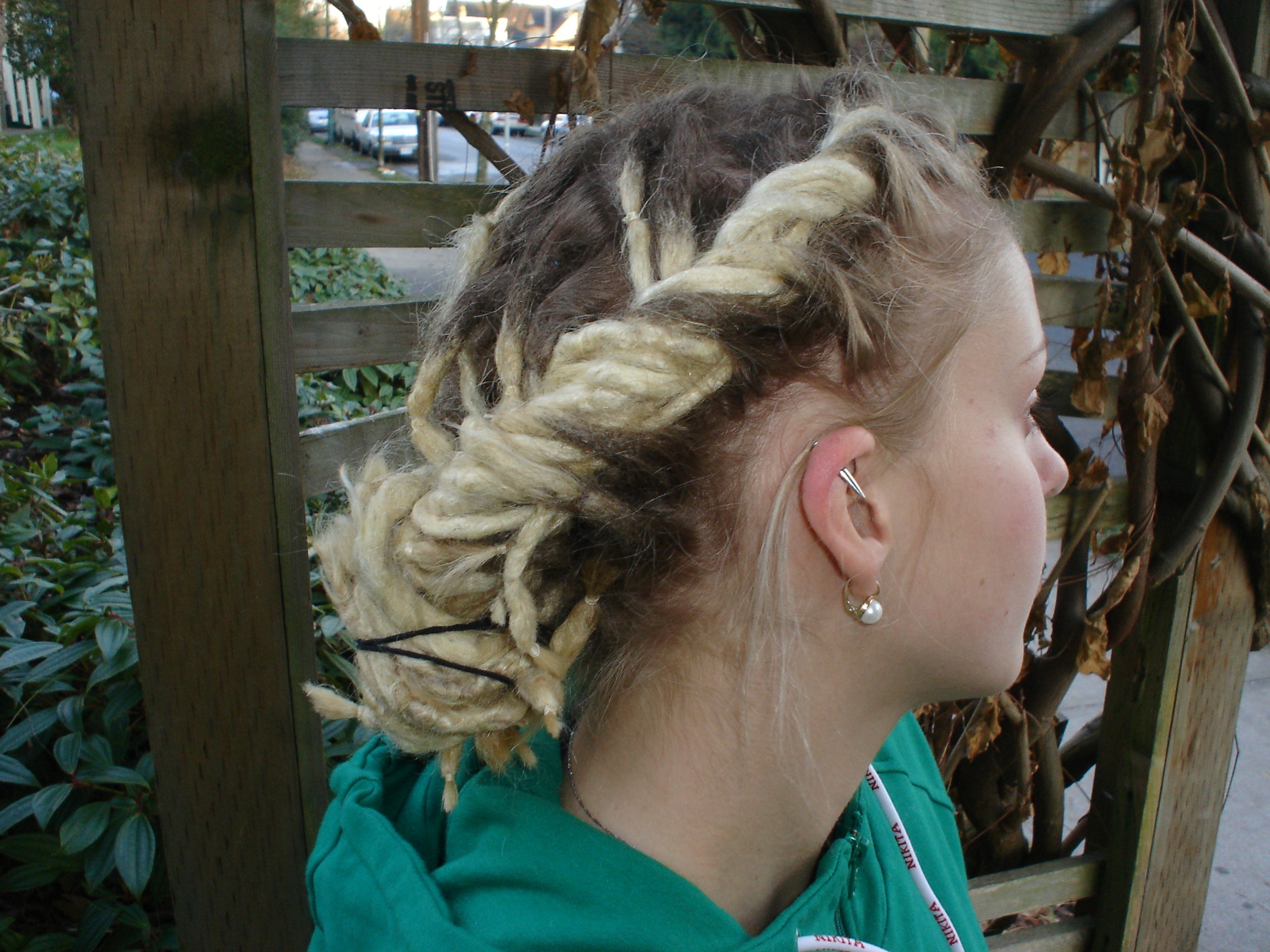 right hand view of french draids dreadlock style showing elastic holding ends together