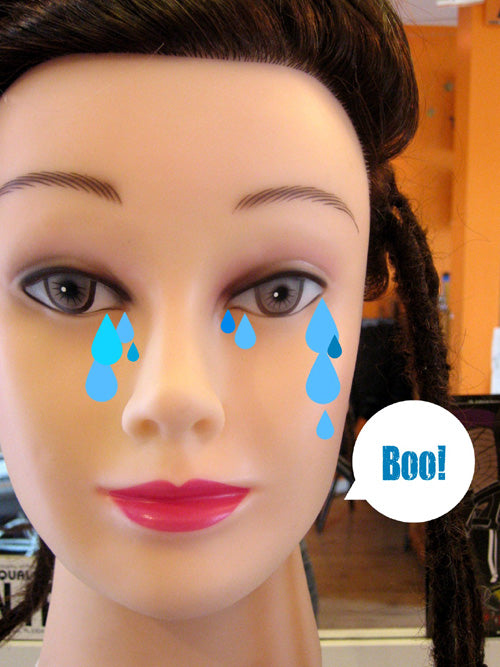 plastic head with superimposed fake tears and voice balloon saying Boo!