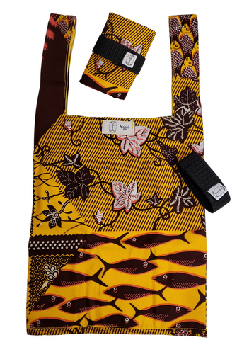A yellow foldable bag from Nohbi Creation made of wax printed fabric.