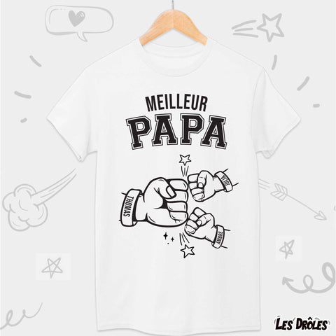 Zoom sur le T-shirt 'Meilleurs Papas', montrant les prénoms des enfants inscrits sous le titre affectueux