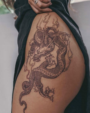 Tattoo uploaded by Jen Mogg  Girly dragon on thigh black flowers  dragontattoo thightattoo birminghamtattoo sevenfoxestattoo  Tattoodo