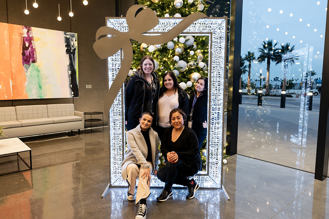 A cool lit frame decorates a lobby for guest to stop and take pictures at. 