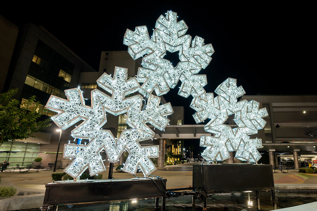 A festive landmark: a building adorned with a sparkling snowflake sculpture, perfect for holiday greetings.