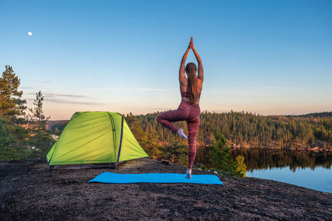 Girl in yoga camping