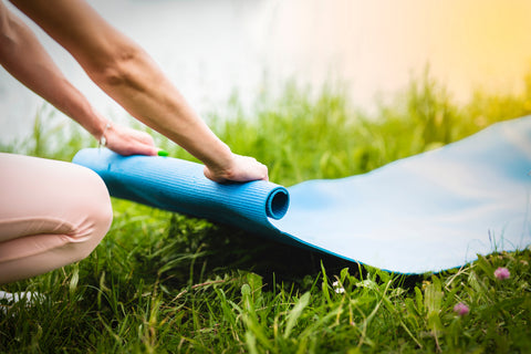 Training outdoors. Fitness mat, yoga, sports