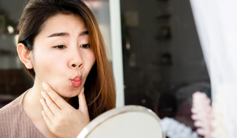 Woman Doing Face Yoga