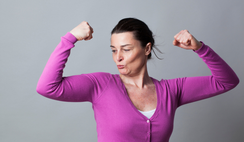 Strong Woman In Her 40s Posing With Purple Cardigan On