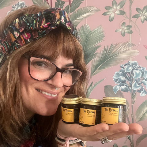 Natural Skincare Creator Emily Davis Holding Her Vegan Face Creams