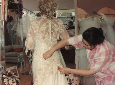 Sharon Schamber fitting a wedding dress