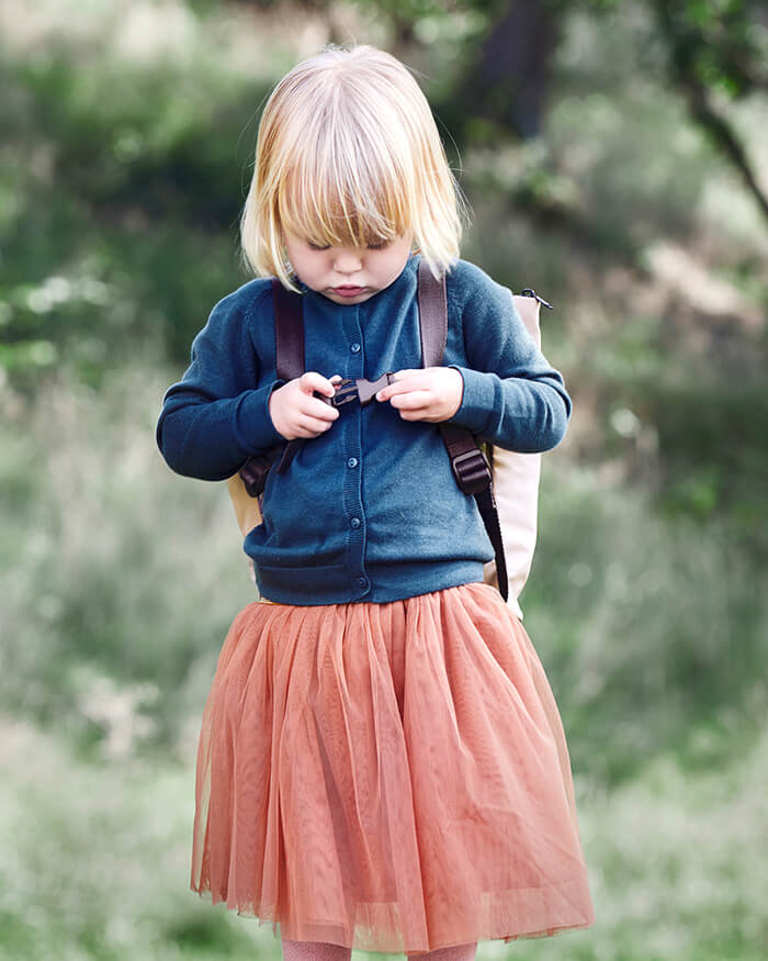 Girl with kids backpack from Done by Deer