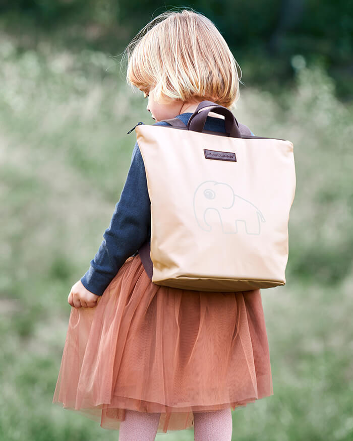 Girl with kids backpack from Done by Deer in powder with Elphee elephant print in powder made in recycled polyester