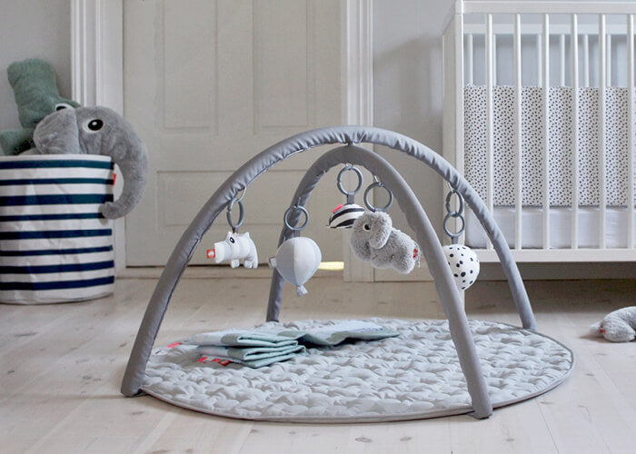 Activity play mat with toys in grey from Done by Deer