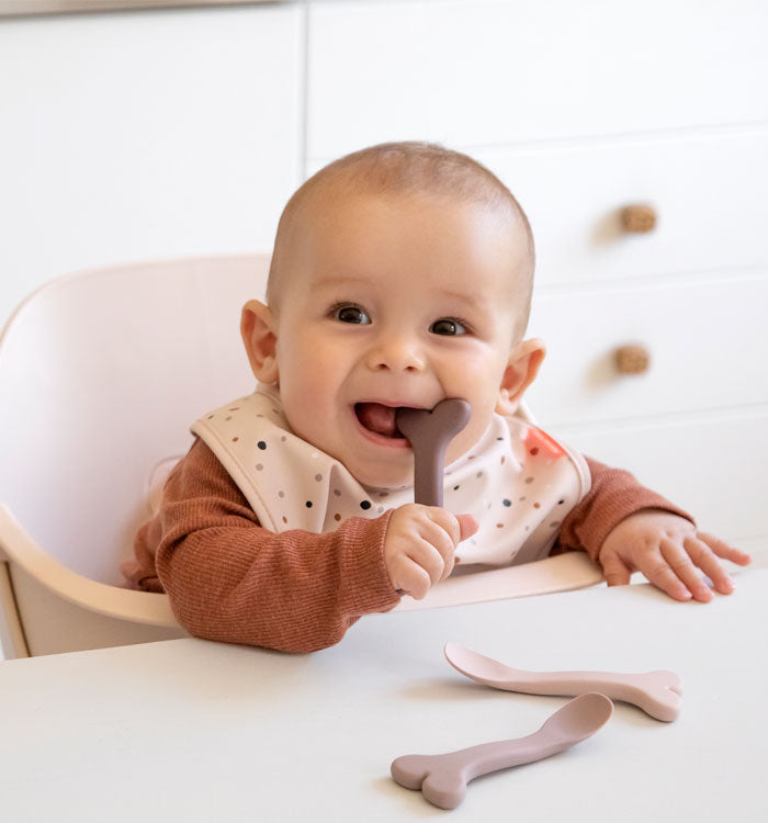 Baby eating from a silicone baby spoon