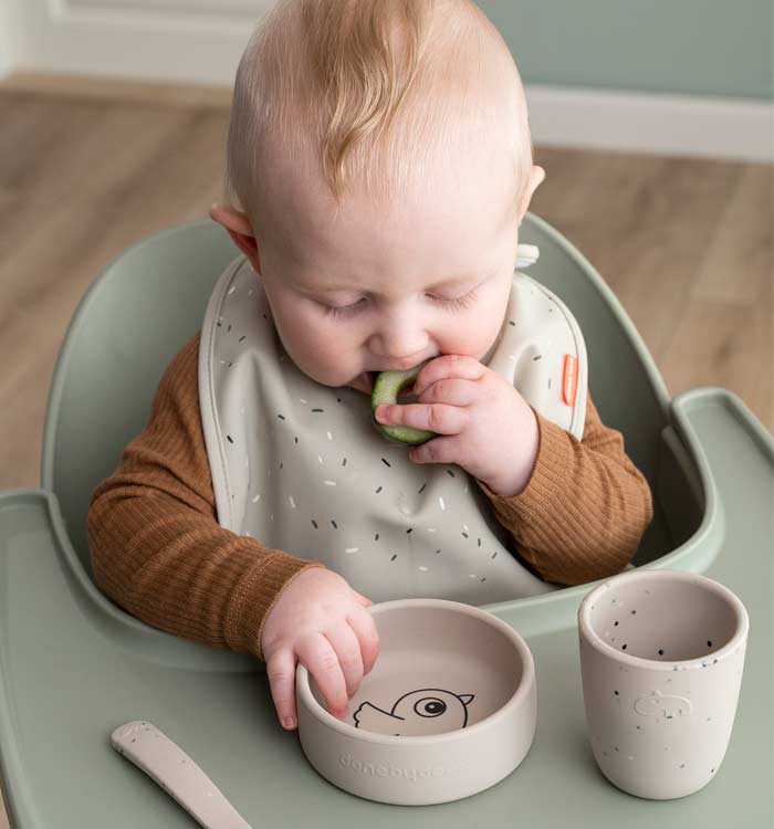 Baby eating from Done by Deer first meal set