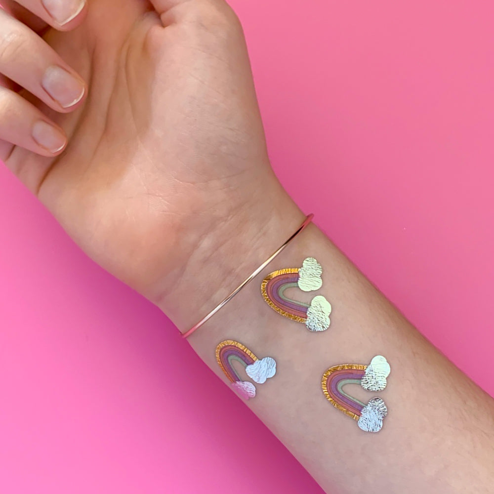 Lovely Rainbow metallic tattoo party tat set featuring 10 pre-cut metallic tattoos. The perfect addition to birthday parties, celebrations and more!