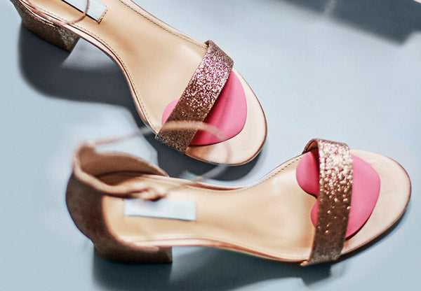 Glittery pink heels with pink heart ball of foot cushions