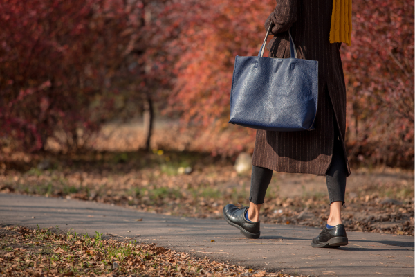 Woman in fall clothing walking outside