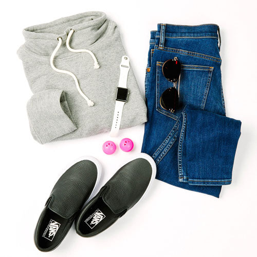 blue jeans, gray hoodie, watch, black slip-on shoes, and pink shoe deodorizer balls