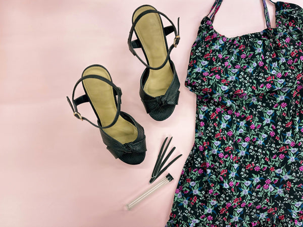 Strap cushions, black high heels, and a floral dress