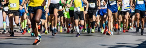 group of runners participating in a marathon or 5k