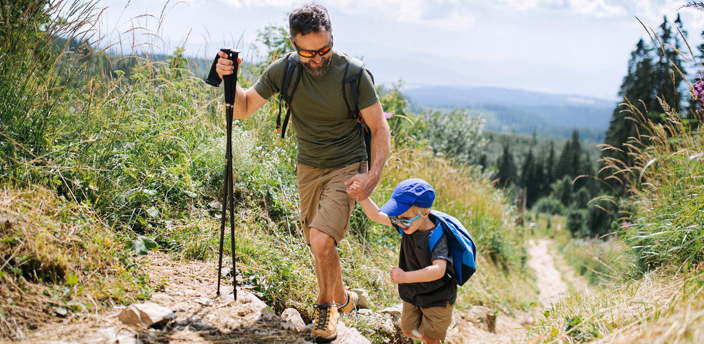 Father and son hiking during the summertime