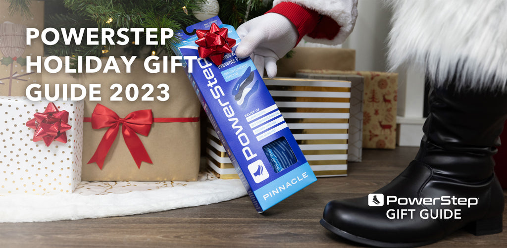 Santa placing PowerStep insoles under the Christmas tree