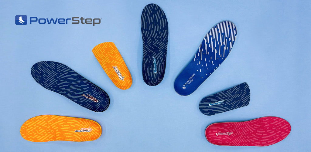 Flatlay of seven types of orthotic insoles