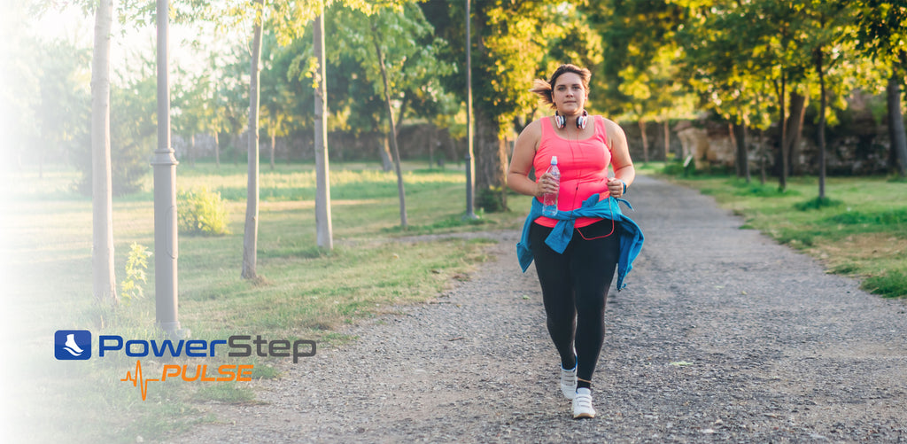 overweight woman running outdoors