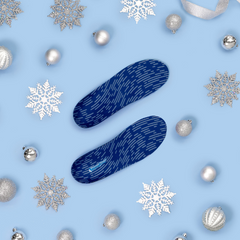 blue orthotic insoles surrounded by silver holiday decor