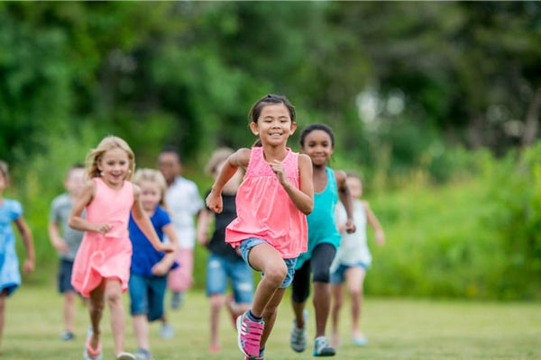 Group of young girls running outside