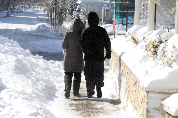 a couple walking outdoors in winter