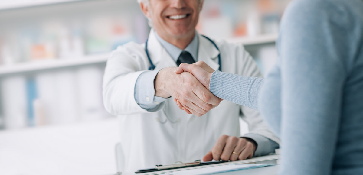 doctor shaking hands with patient