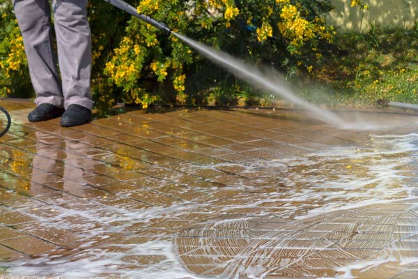 Use detergent to clean driveway