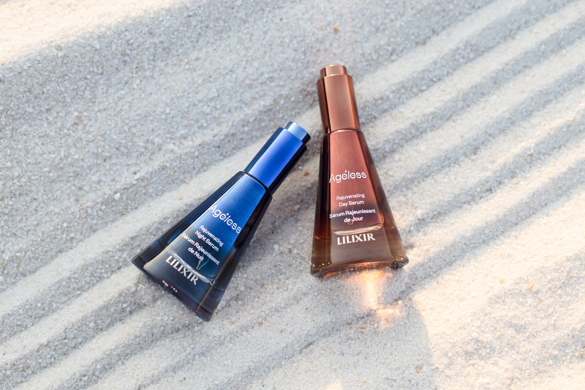 LILIXIR_Ageless_Collection_Rejuvenating_Day_and_Night_Serums on sand