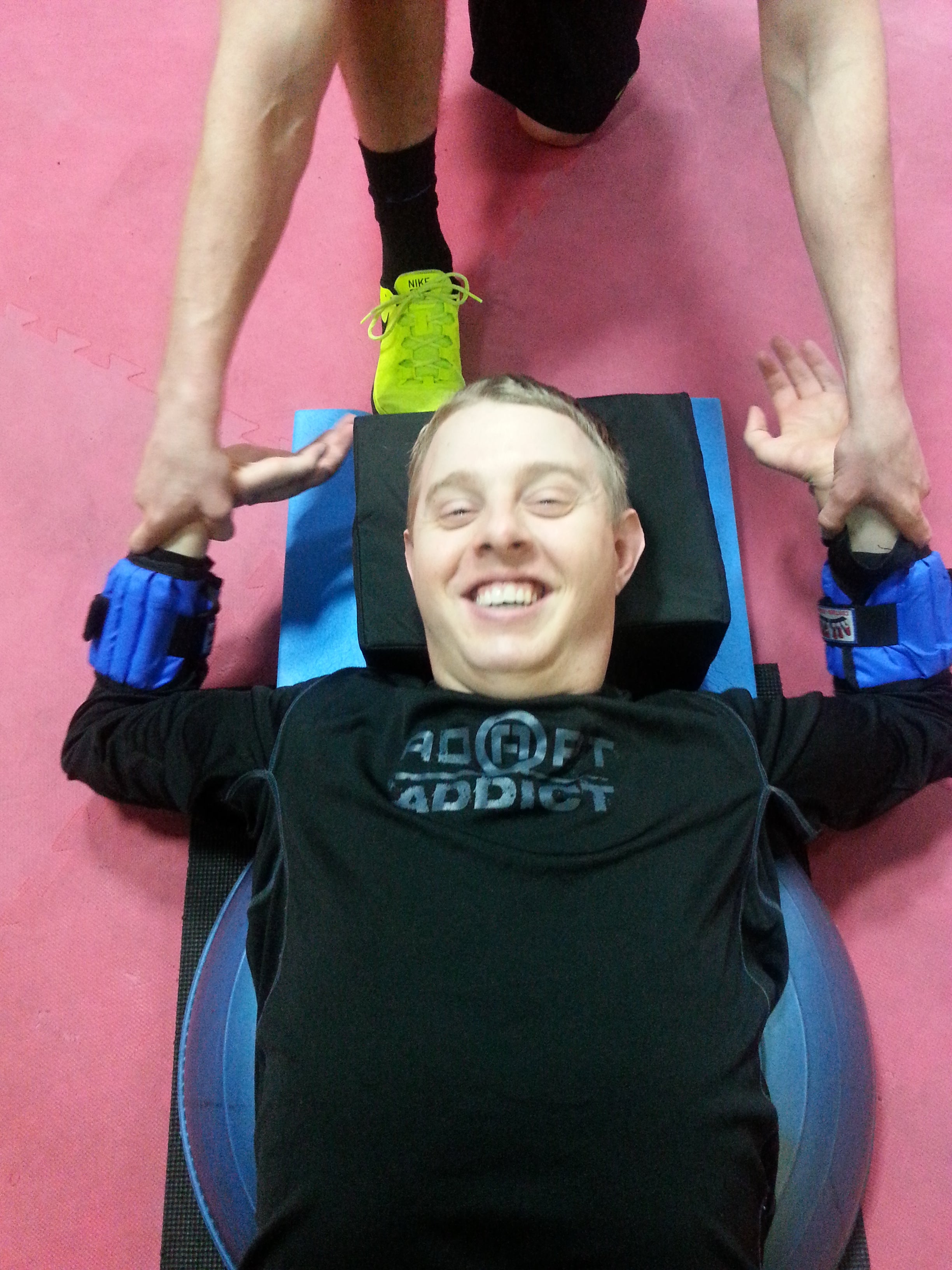 The author, Jake French, doing weighted range of motion exercises to strengthen rotator cuff