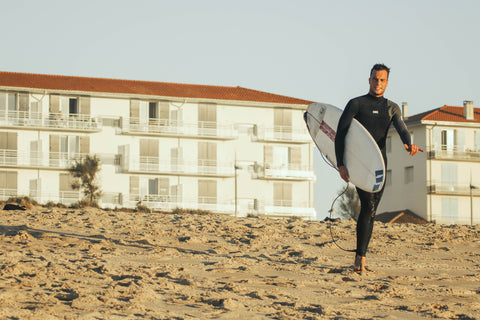 Surfer wearing a 3/2mm thick neoprene wetsuit