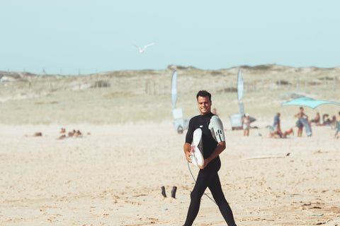 Surfer wearing a 2/2mm thick neoprene wetsuit
