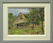 Load image into Gallery viewer, A 9 x 12 inch oil painting of a stone cottage left of centre, with an apple tree laden with red apples right of centre foreground, showing grey and cream frame.
