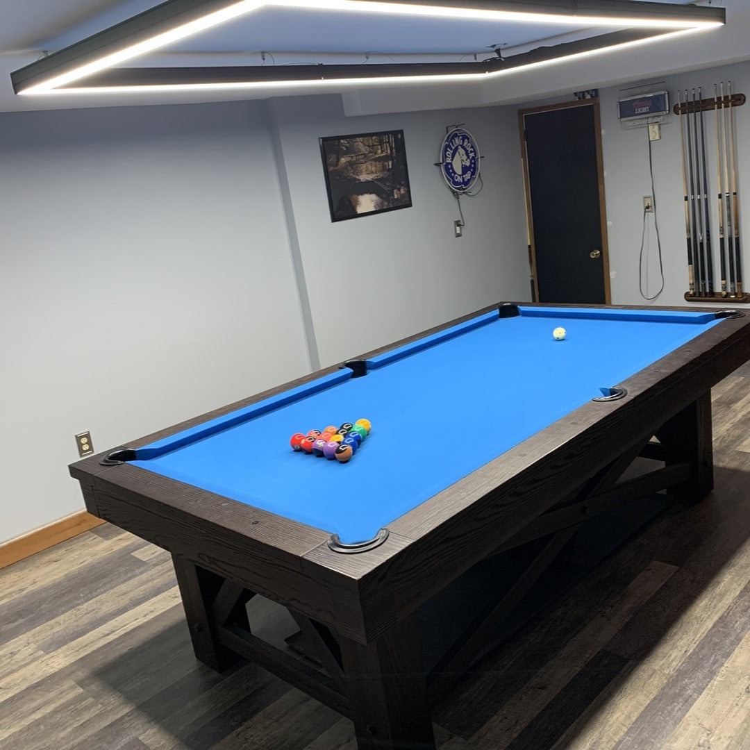 Modern billiard table and light setup in a living room