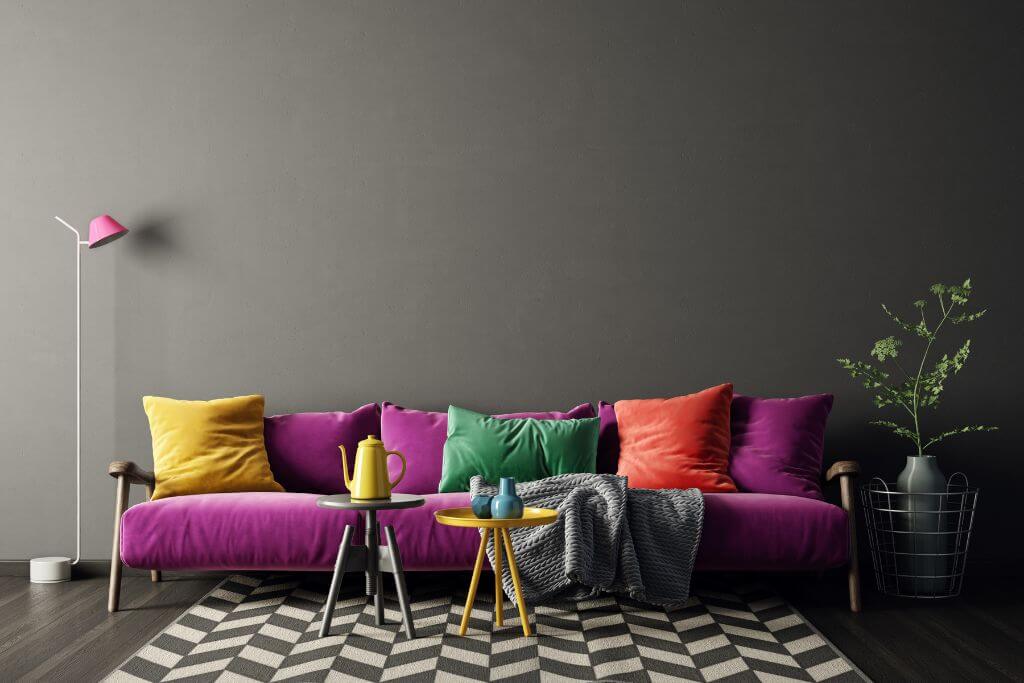 Purple sofa with colorful pillows
