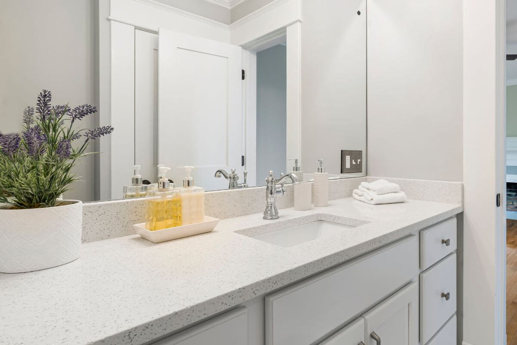 Small  lavander plant on the bathroom marble counter