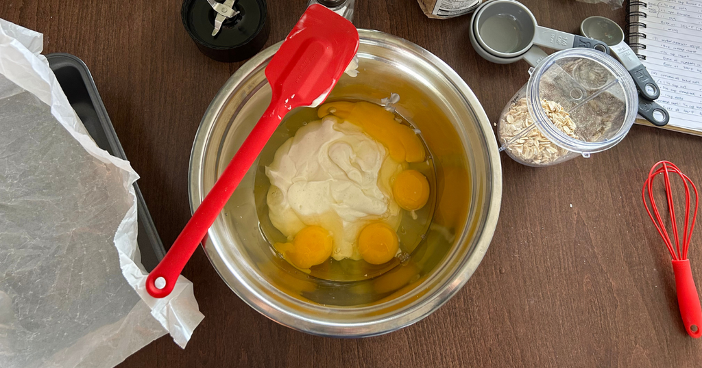 Mixing bowl with yogurt and eggs inside