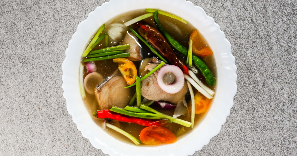 A bowl of sinigang (a sour, Filipino soup)