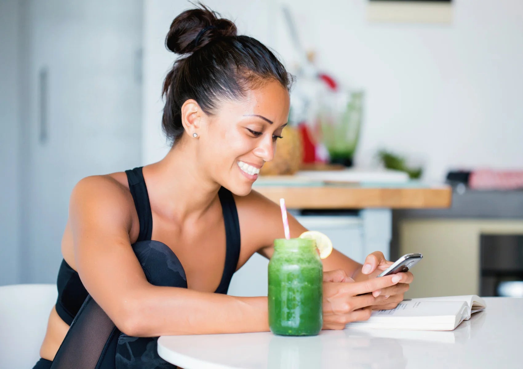 woman in fitness attire drinking green smoothie recipes for a fast weight loss