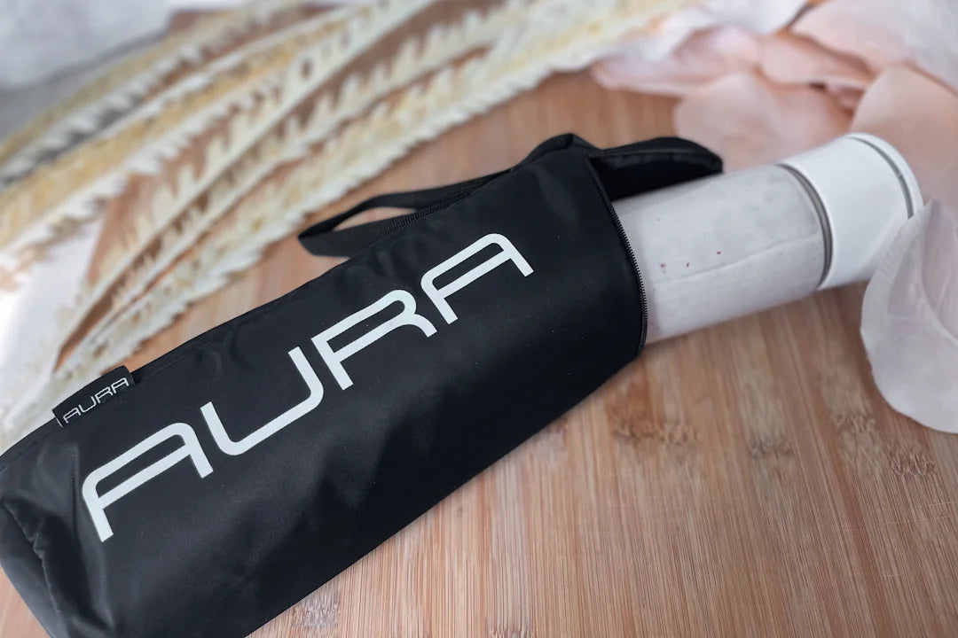 aura portable blender in an aura insulated sleeve on wooden table